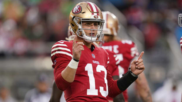49ers quarterback Brock Purdy (13) looks towards the sideline before running a play against the Buccaneers.